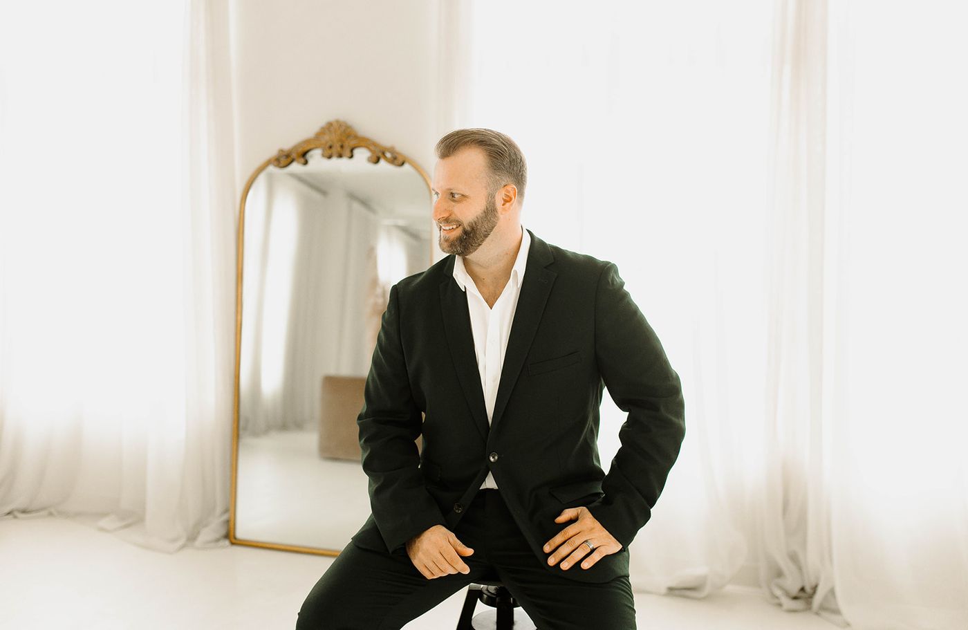 Trevor Barber seated in a bright studio
